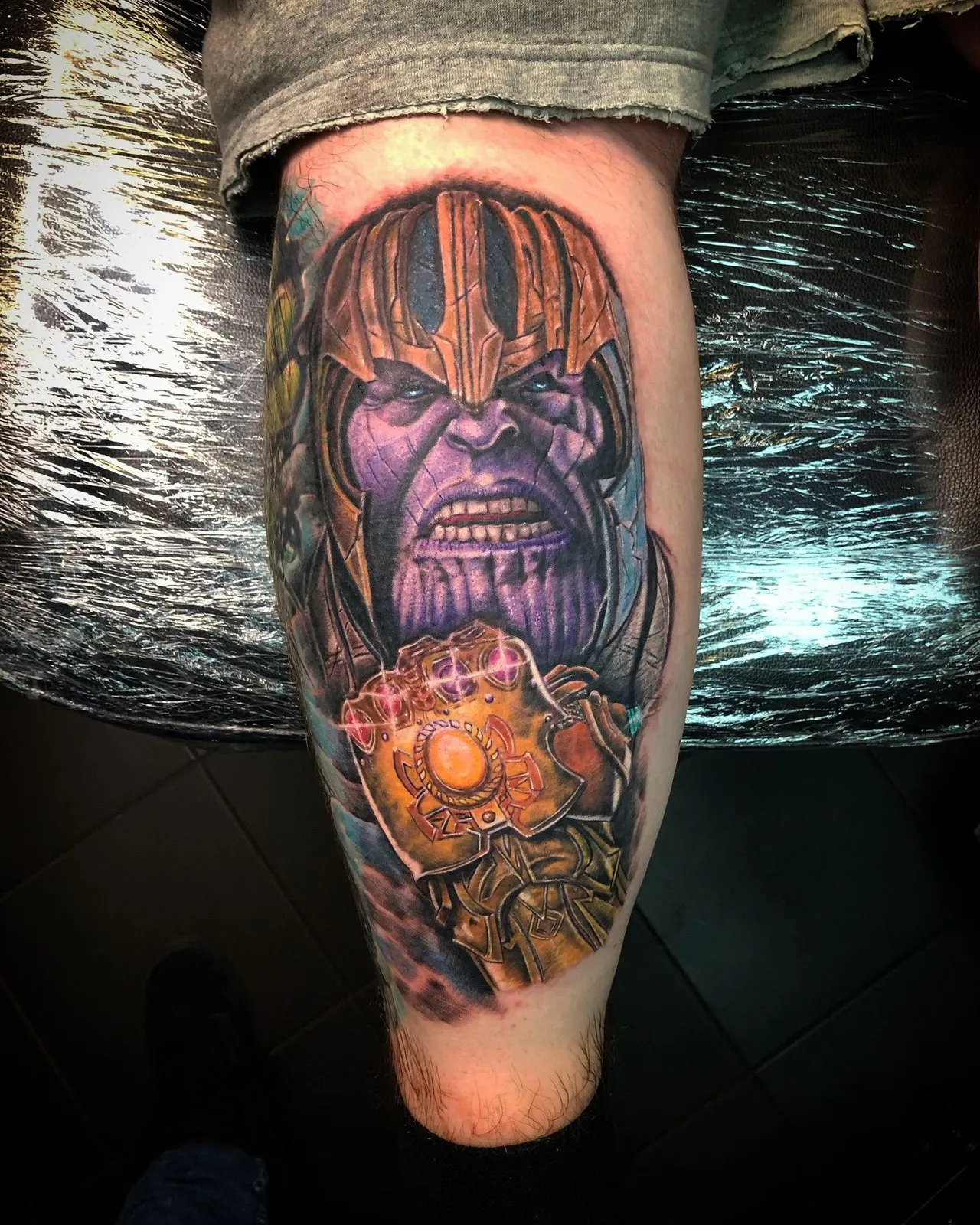 Colour realism Thanos with the Infinity Gauntlet, calf tattoo by Raf at Shade Studio Peterborough
